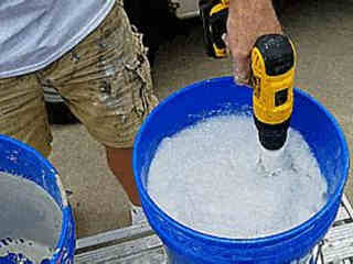 Attaching a roller to a drill and spinning in water.